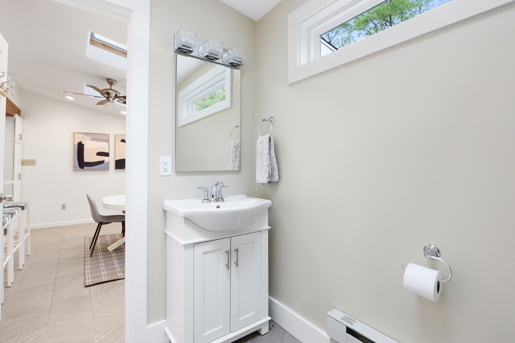 28 Longfellow Road Natick, MA 01760 - Photo 18 of 30 a bathroom with a sink a toilet and mirror