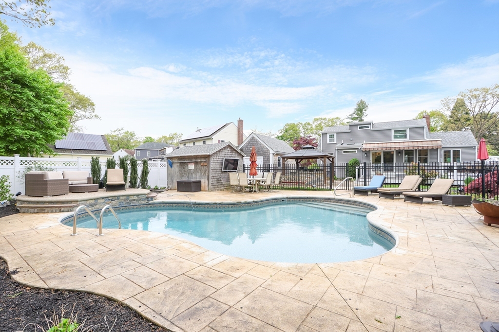 28 Longfellow Road Natick, MA 01760 - Photo 19 of 30 a view of a swimming pool and a lounge chair