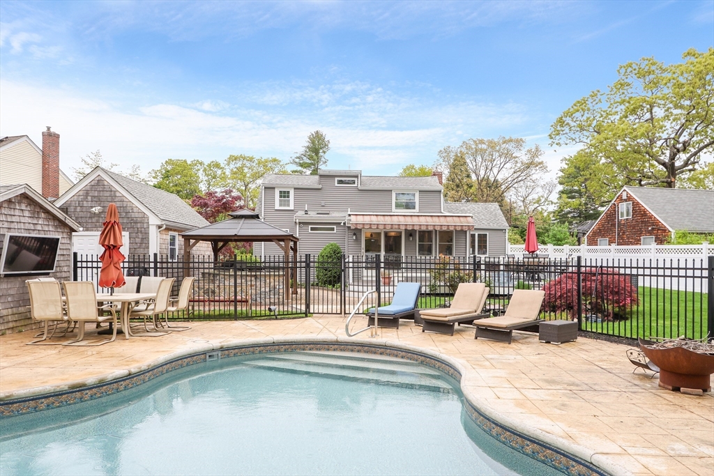 28 Longfellow Road Natick, MA 01760 - Photo 20 of 30 a swimming pool view with a outdoor seating