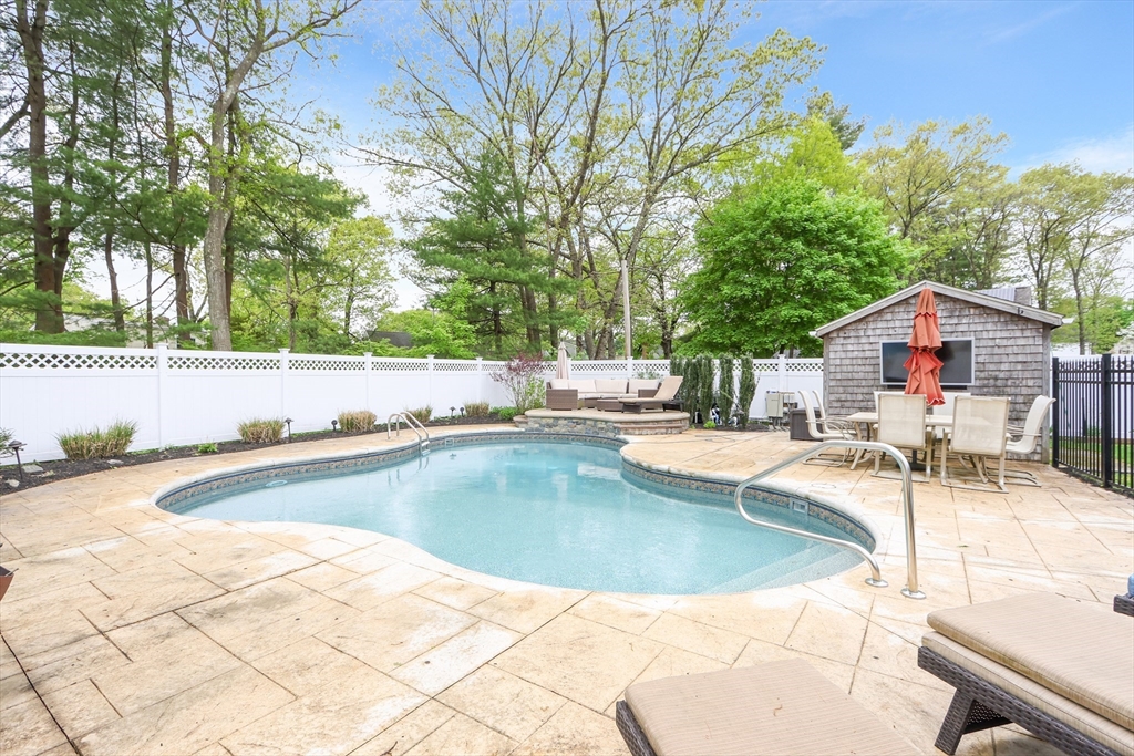 28 Longfellow Road Natick, MA 01760 - Photo 21 of 30 a view of a swimming pool and lounge chair