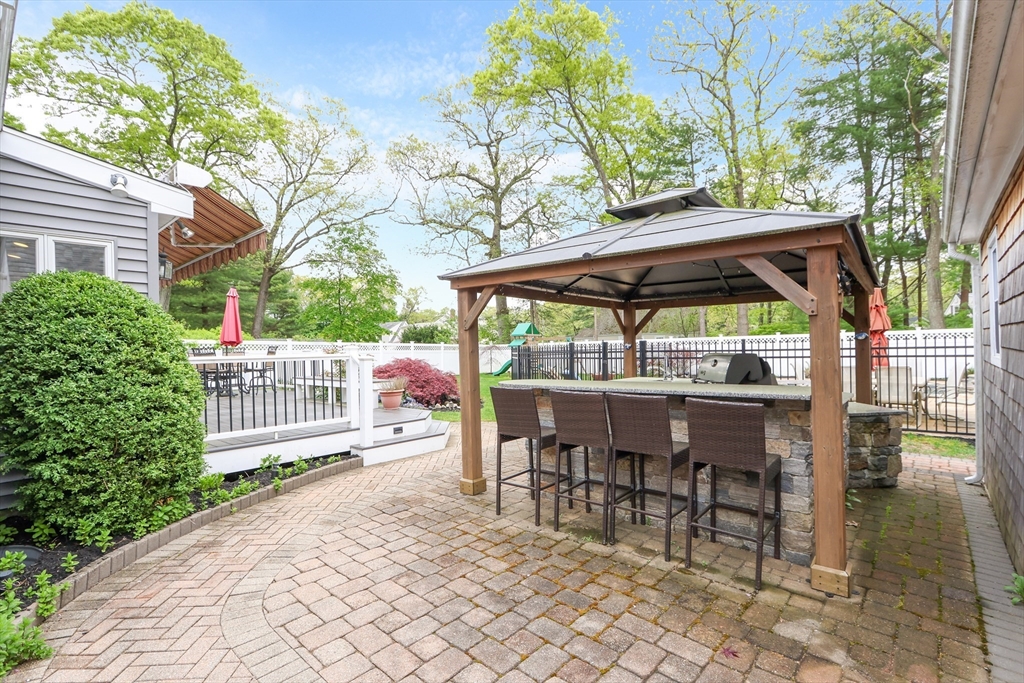 28 Longfellow Road Natick, MA 01760 - Photo 24 of 30 a view of house with a deck and furniture