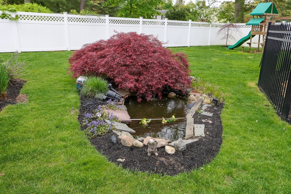 28 Longfellow Road Natick, MA 01760 - Photo 28 of 30 a garden view with a seating space