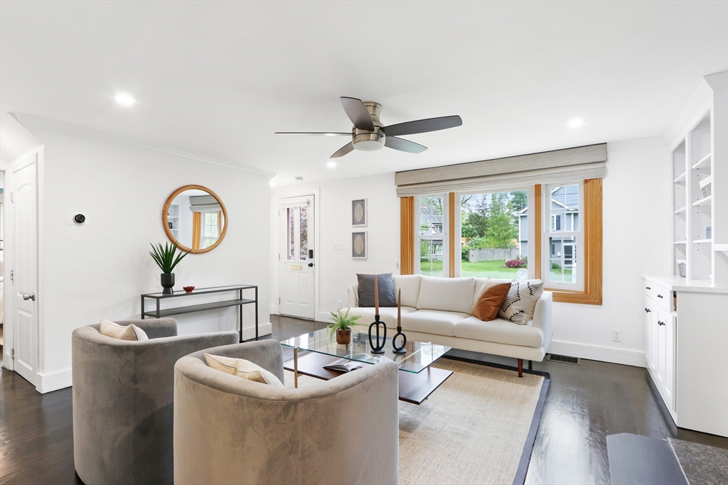 28 Longfellow Road Natick, MA 01760 - Photo 4 of 30 a living room with furniture a window and a chandelier