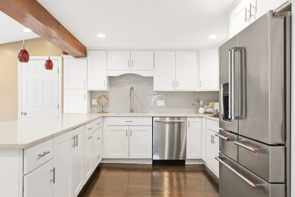 28 Longfellow Road Natick, MA 01760 - Photo 6 of 30 a kitchen with white cabinets and white appliances