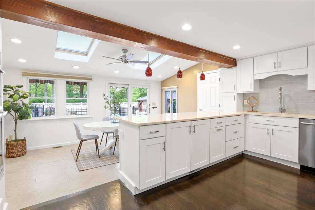 28 Longfellow Road Natick, MA 01760 - Photo 8 of 30 a open kitchen with white cabinets and wooden floor