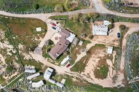 an aerial view of residential house with outdoor space