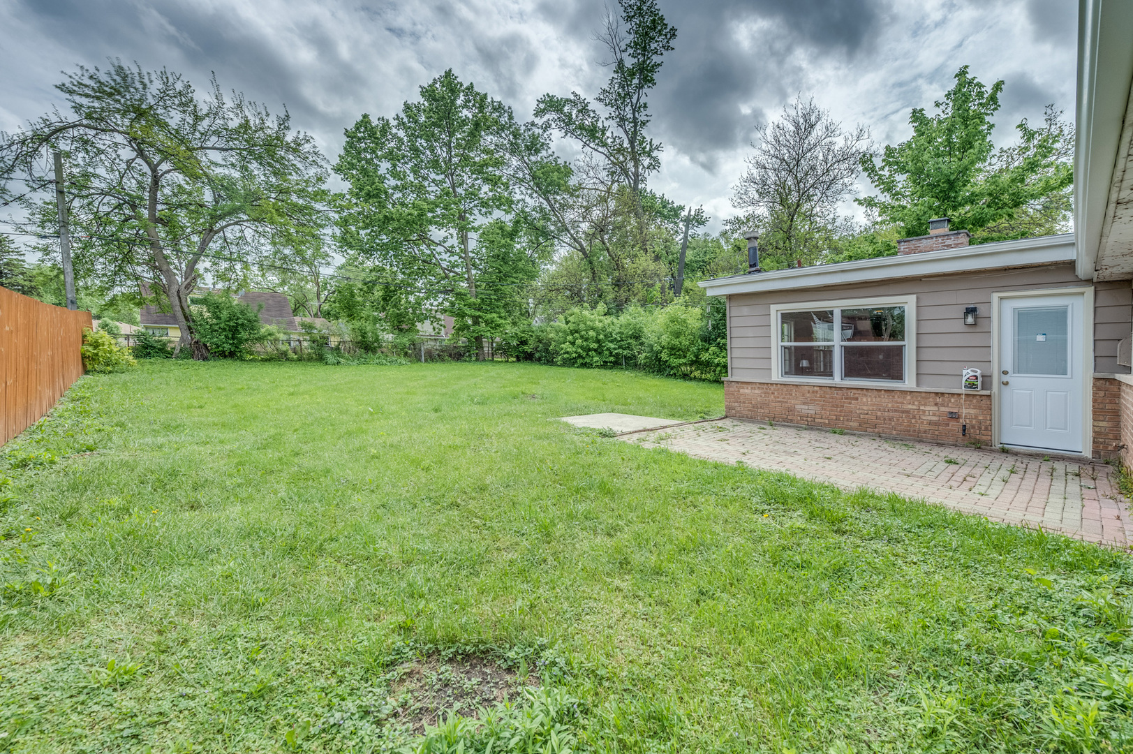 407 Watseka Street Park Forest, IL 60466 - Photo 19 of 21 a backyard of a house with seating space