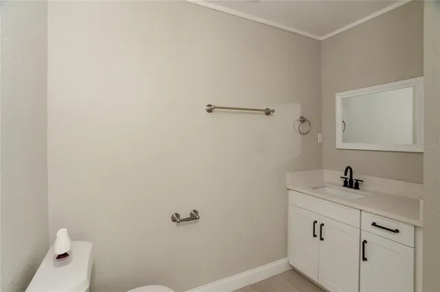 a front view of a house with a garden and porch