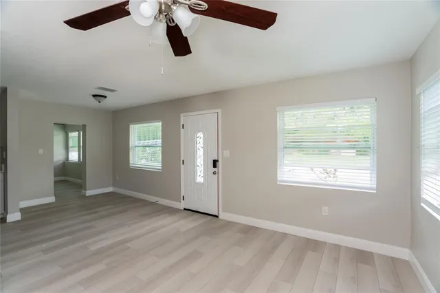 a view of an empty room with a window