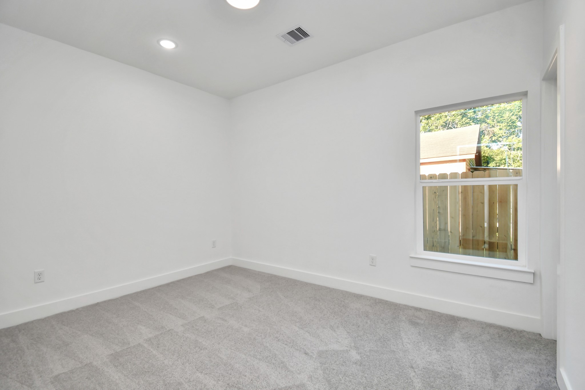 8109 Hamlet Street Houston, TX 77078 - Photo 17 of 50 an empty room with a window