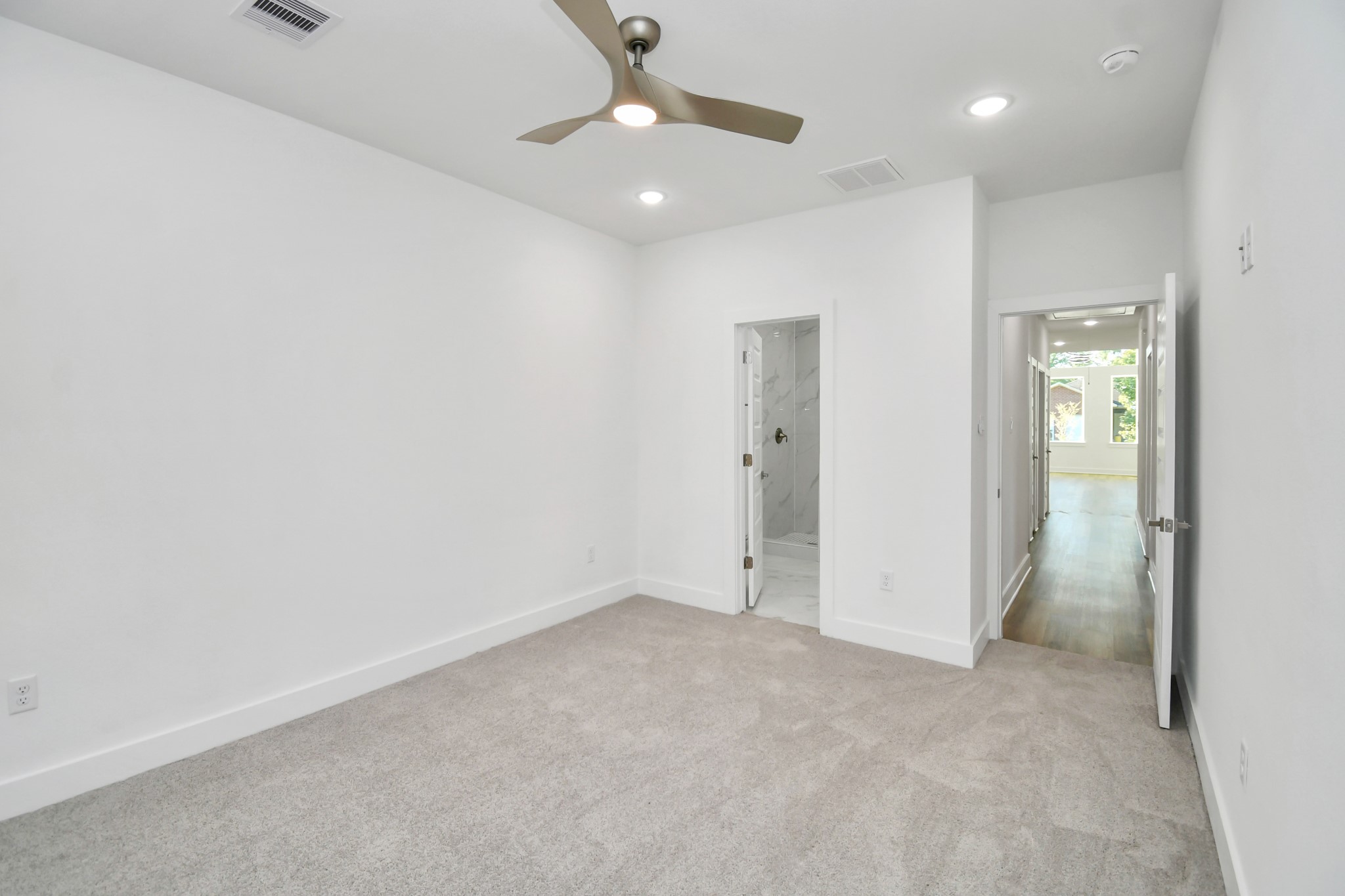 8109 Hamlet Street Houston, TX 77078 - Photo 23 of 50 an empty room with fan and entrance