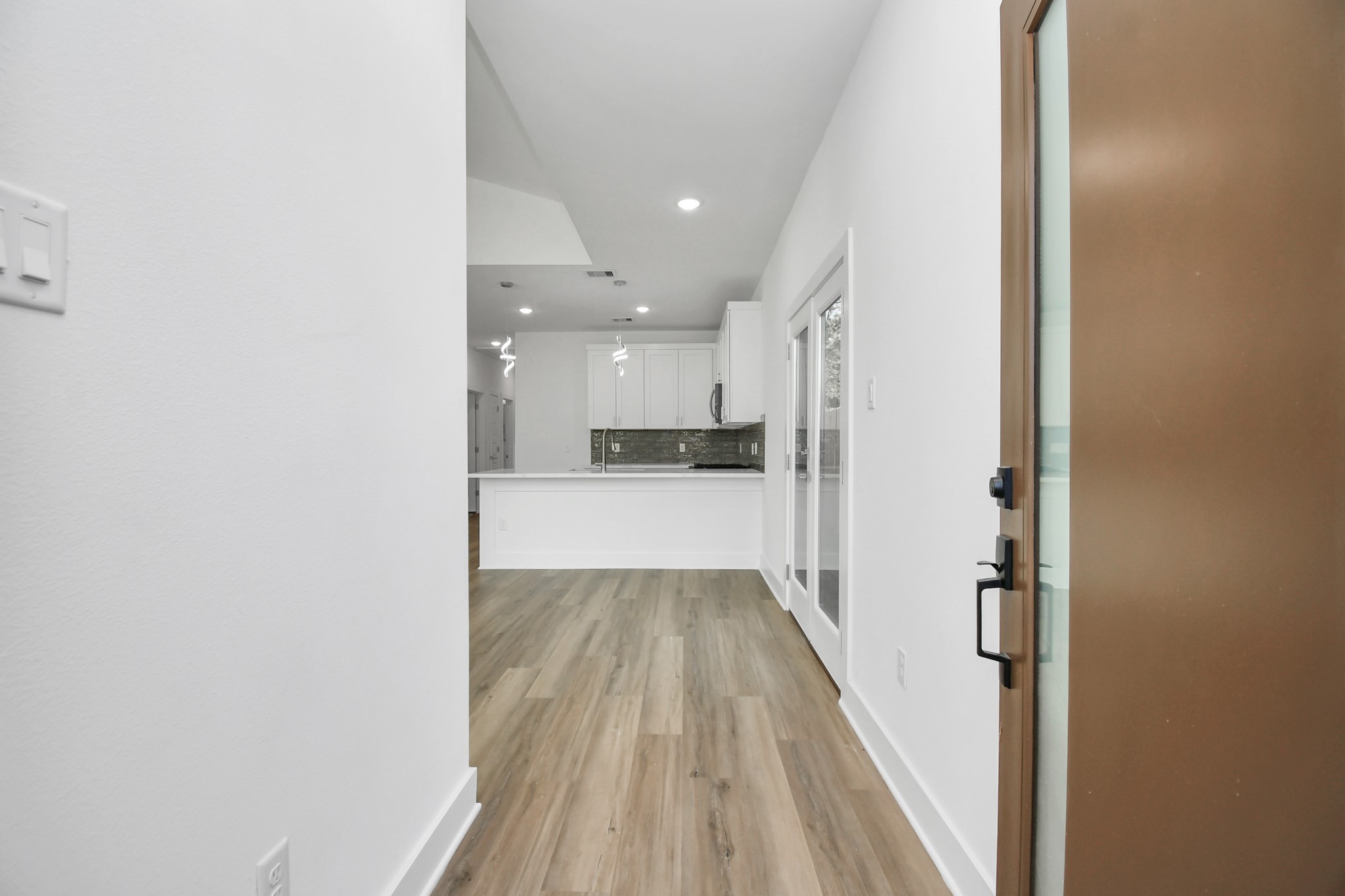 8109 Hamlet Street Houston, TX 77078 - Photo 29 of 50 a view of a kitchen from the hallway