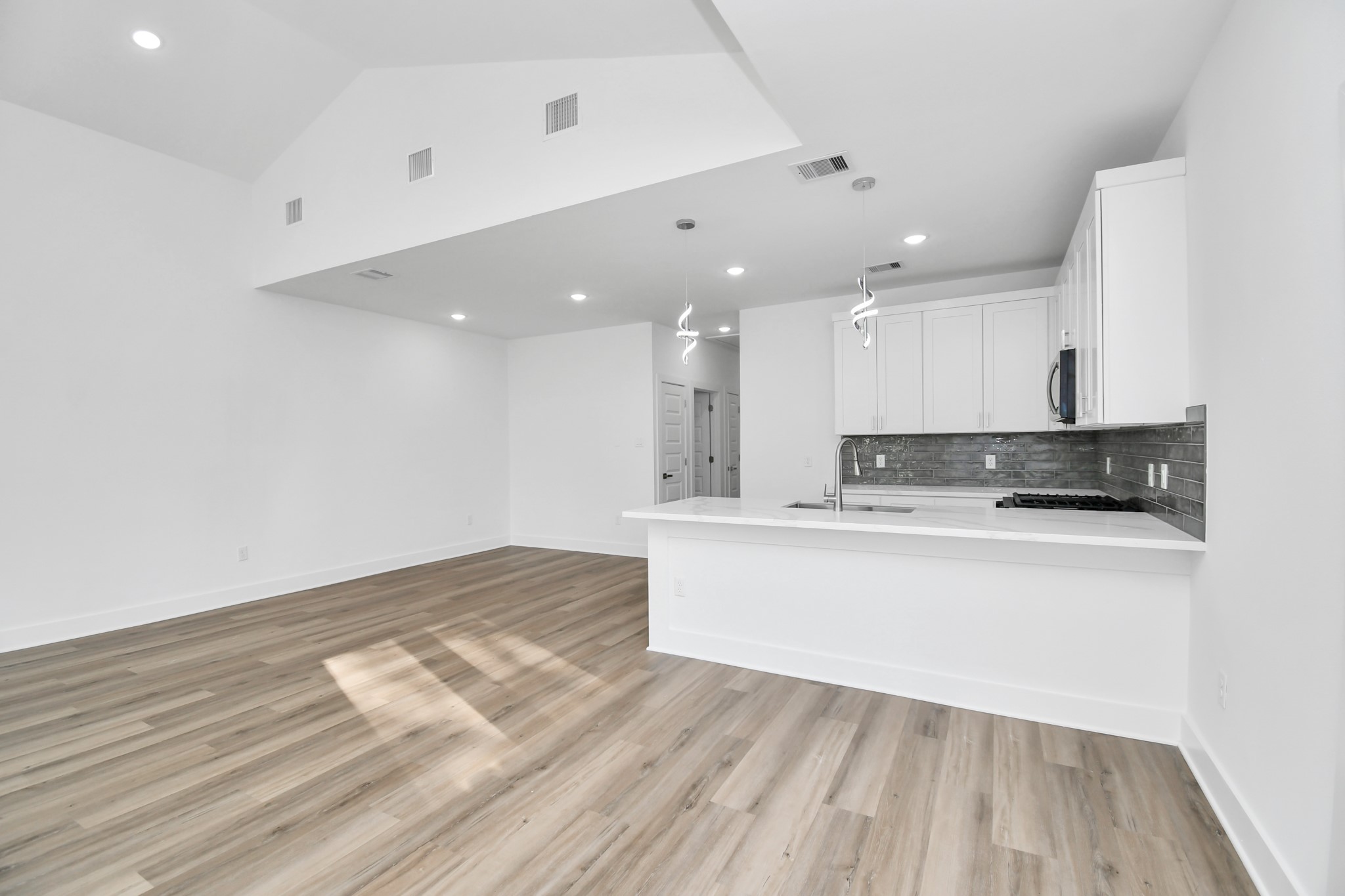 8109 Hamlet Street Houston, TX 77078 - Photo 30 of 50 a view of kitchen with kitchen island wooden floor and center island
