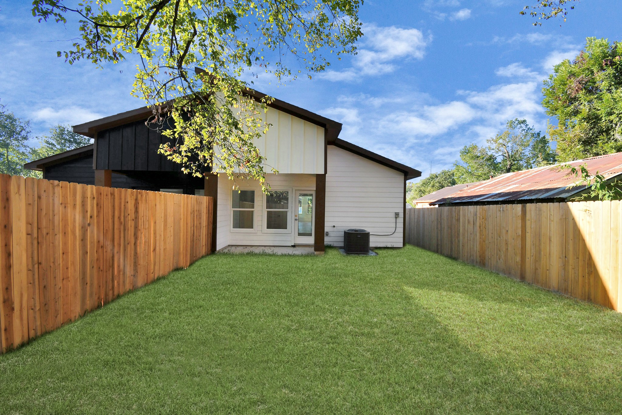 8109 Hamlet Street Houston, TX 77078 - Photo 3 of 50 a view of a backyard with plants and large tree