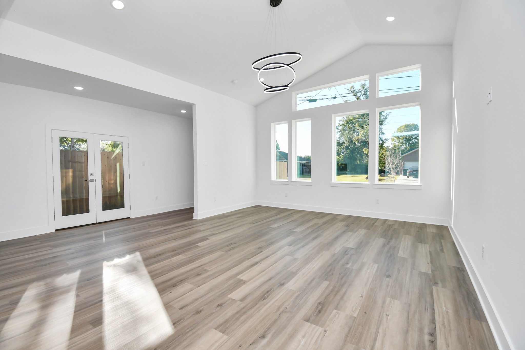 8109 Hamlet Street Houston, TX 77078 - Photo 31 of 50 a view of an empty room with wooden floor and a window