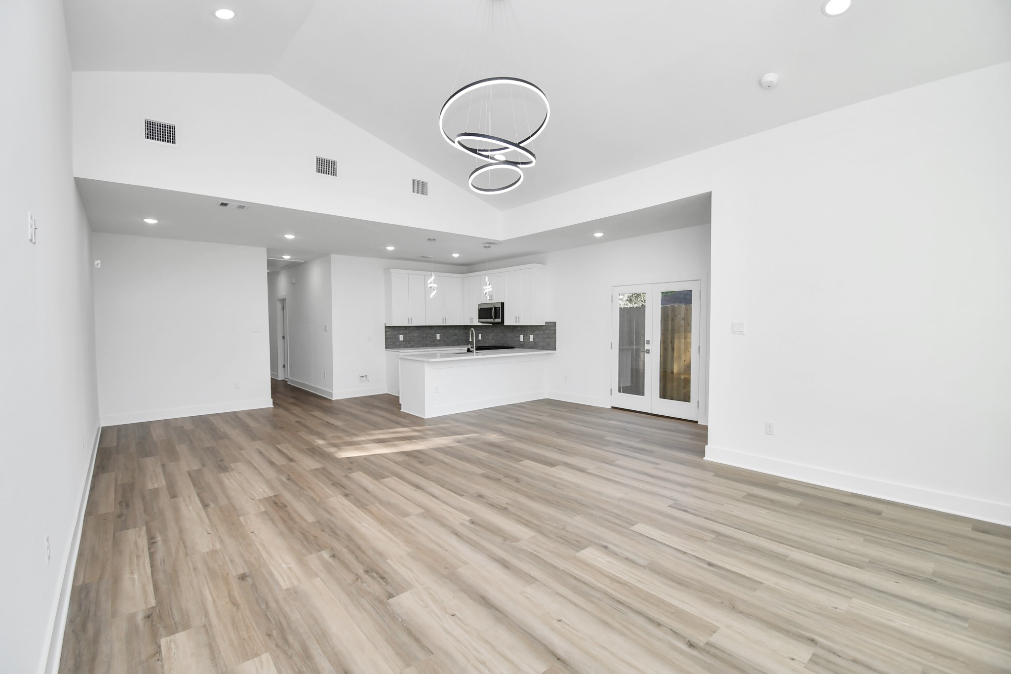8109 Hamlet Street Houston, TX 77078 - Photo 32 of 50 a view of kitchen with refrigerator and wooden floor