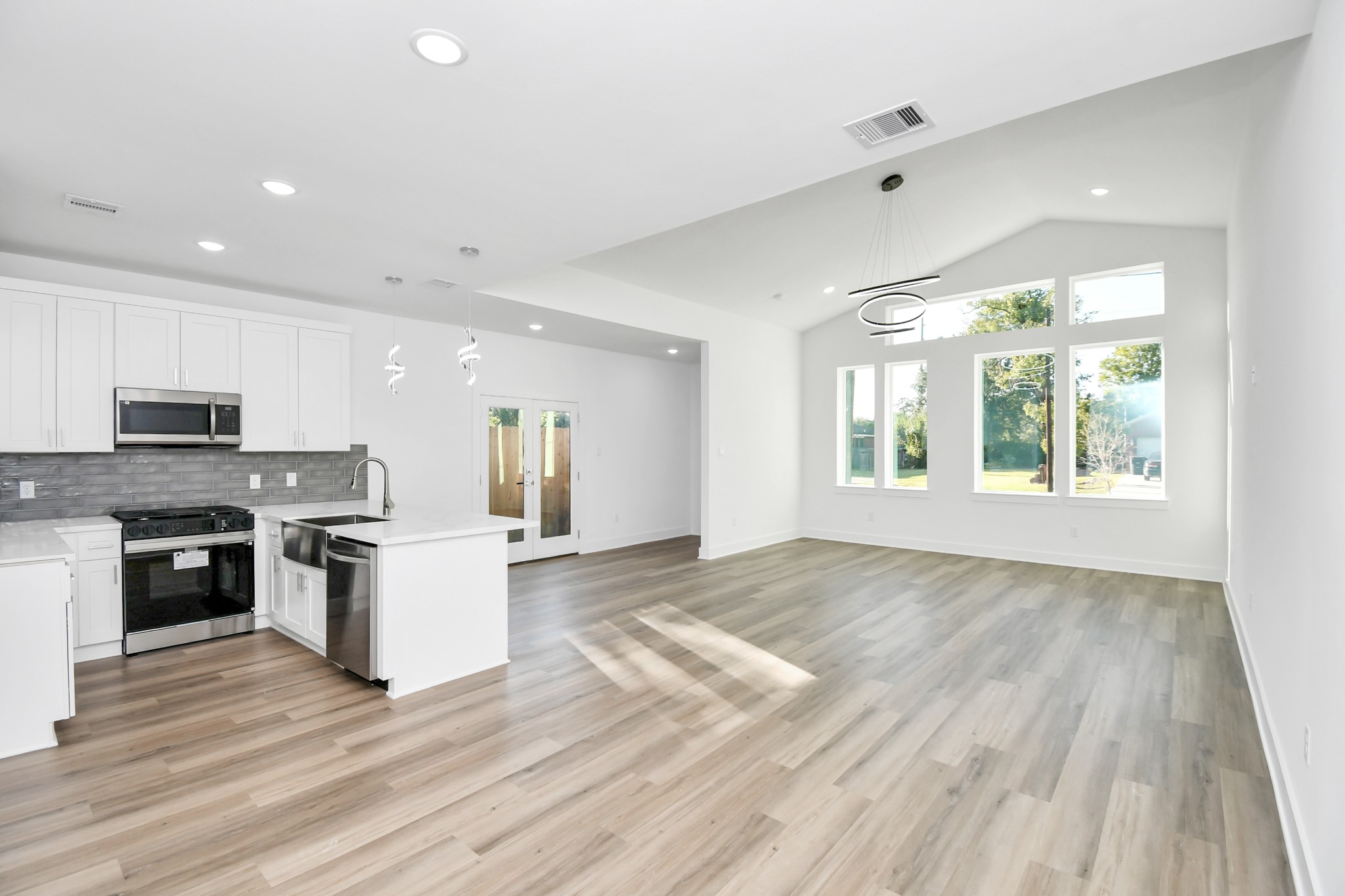 8109 Hamlet Street Houston, TX 77078 - Photo 35 of 50 a large kitchen with stainless steel appliances granite countertop a stove and a refrigerator