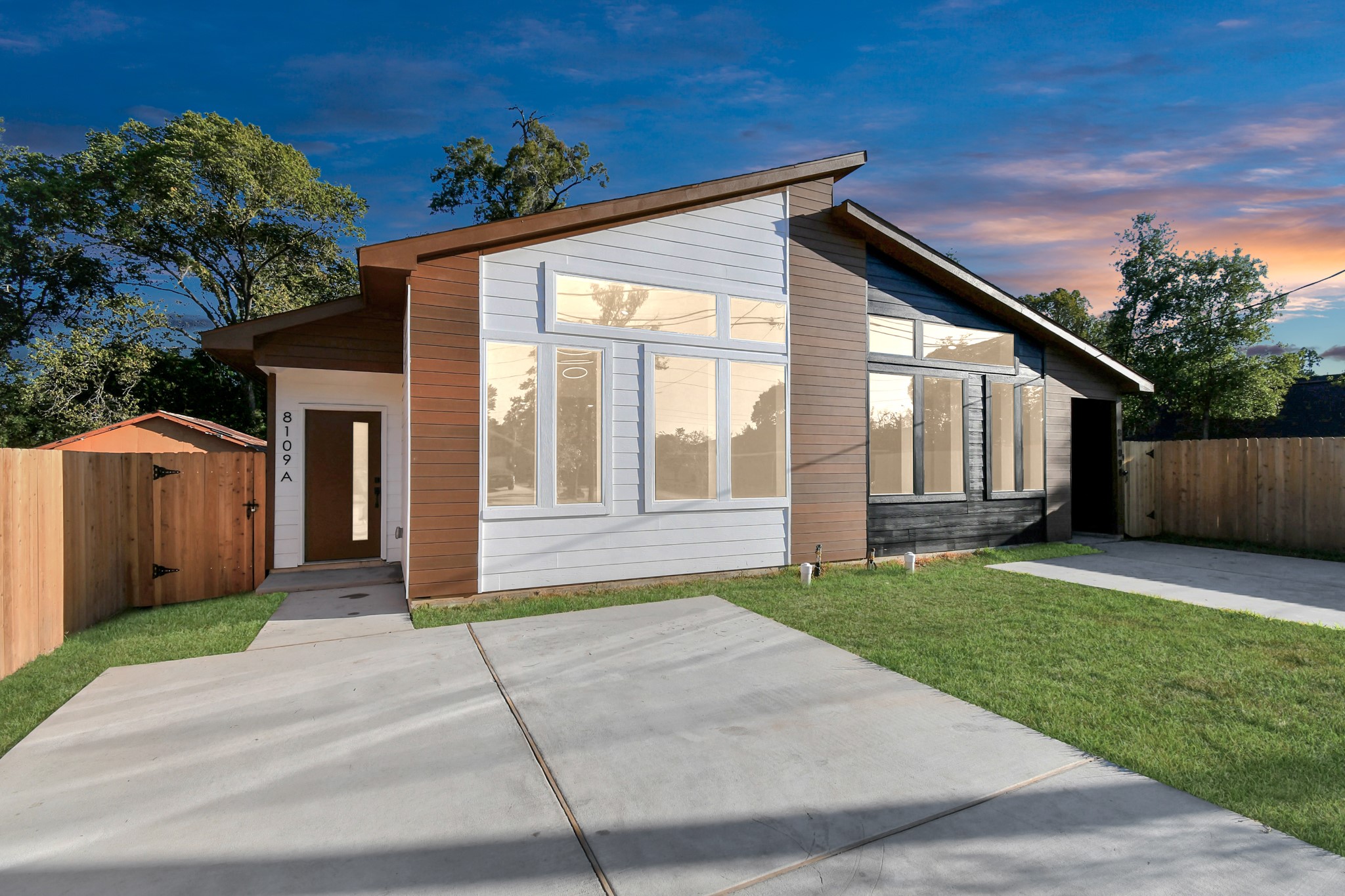 8109 Hamlet Street Houston, TX 77078 - Photo 4 of 50 a front view of a house with a yard and garage
