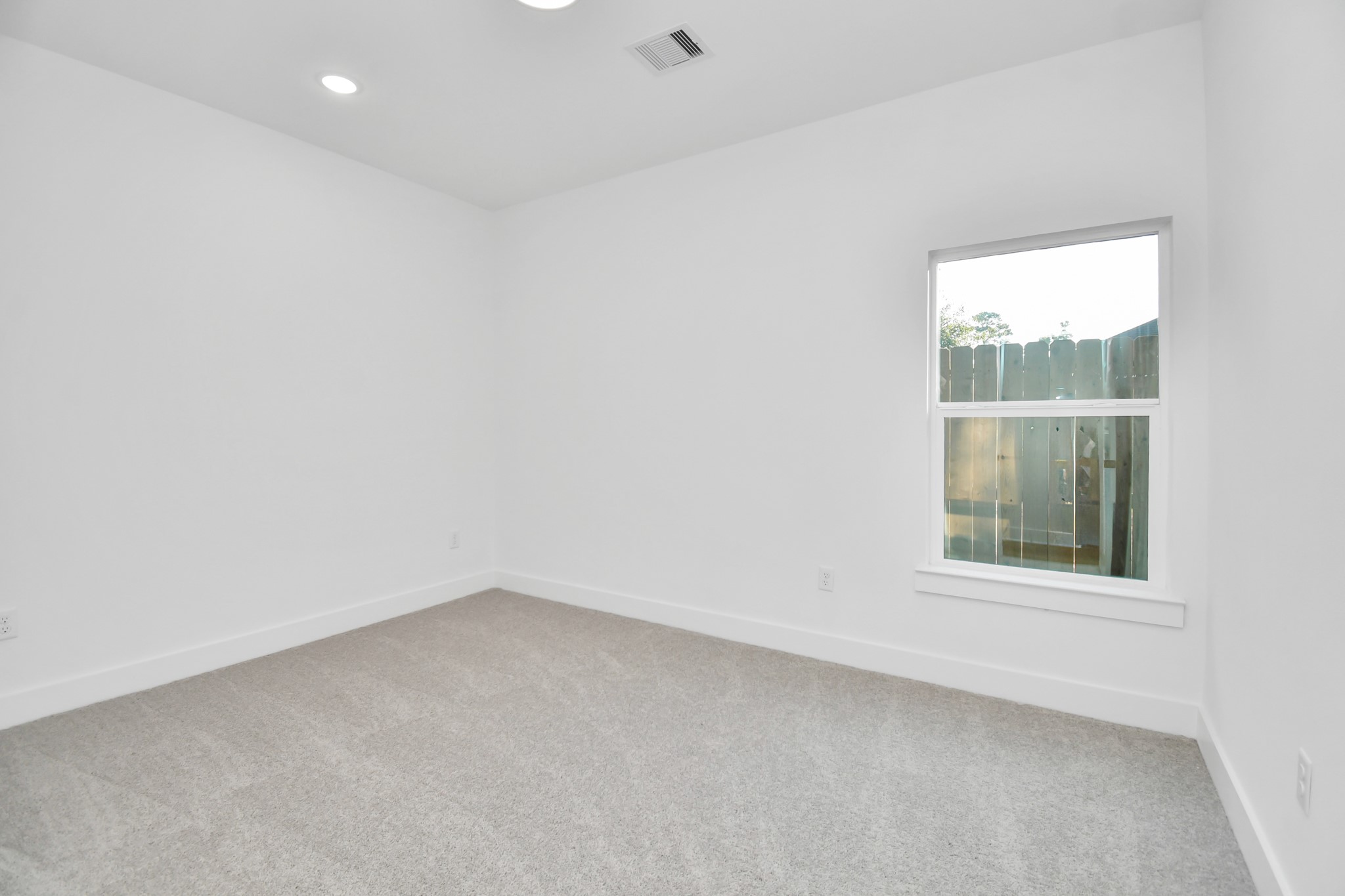 8109 Hamlet Street Houston, TX 77078 - Photo 44 of 50 an empty room with a window