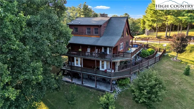 an aerial view of a house with roof deck