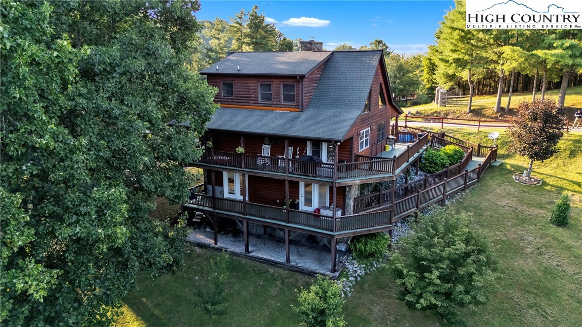 an aerial view of a house with roof deck
