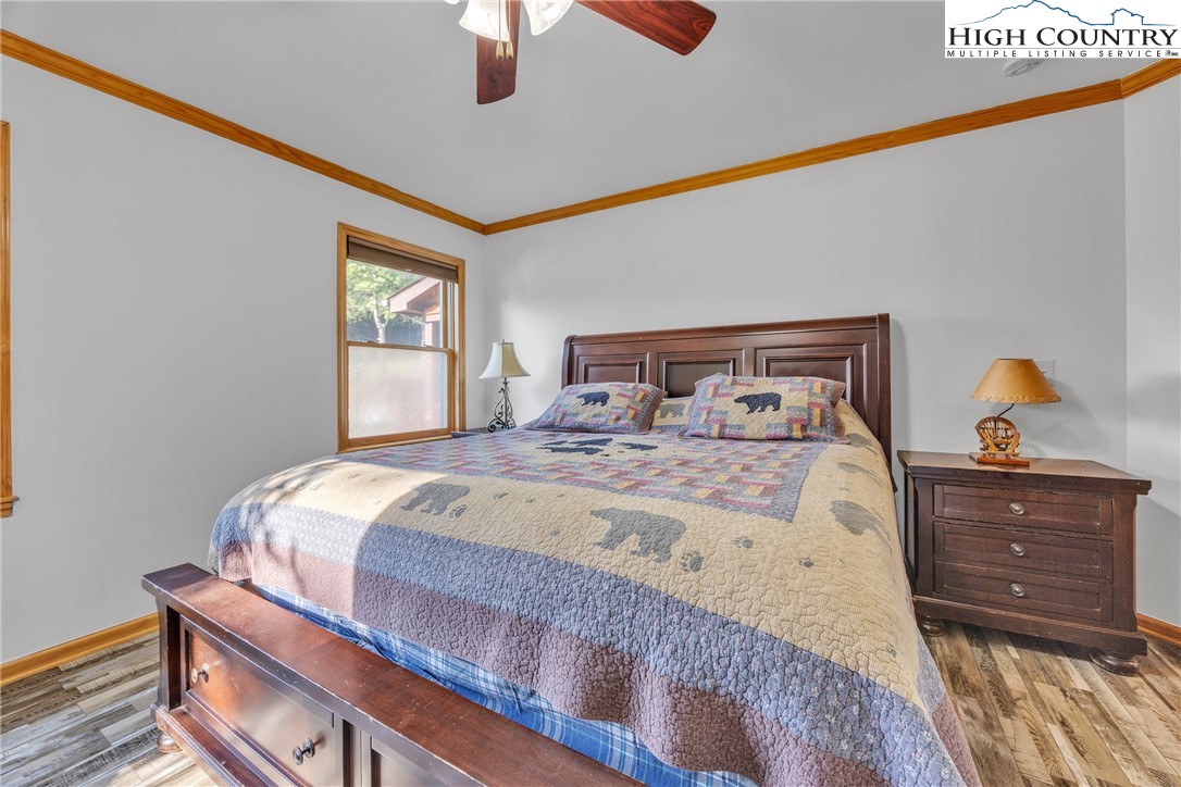98 New Ridge Lane Piney Creek, NC 28663 - Photo 16 of 50 a bedroom with a bed and a dresser