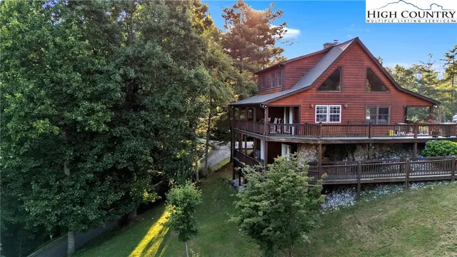an aerial view of a house with a small yard