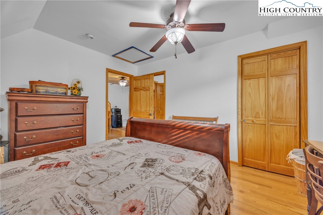 98 New Ridge Lane Piney Creek, NC 28663 - Photo 25 of 50 a bedroom with a bed and a dresser