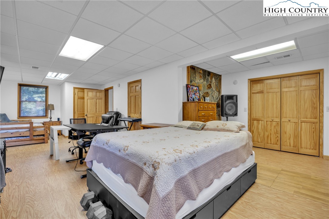 98 New Ridge Lane Piney Creek, NC 28663 - Photo 31 of 50 a bed room with a bed and furniture