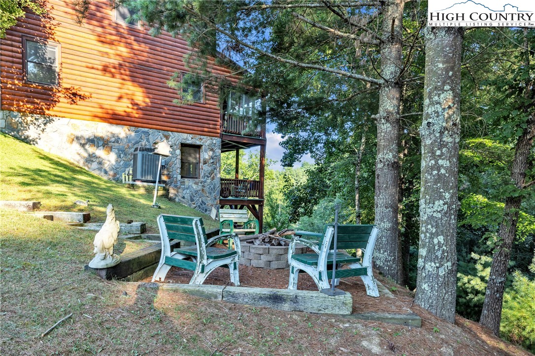 98 New Ridge Lane Piney Creek, NC 28663 - Photo 43 of 50 a view of a chairs and table in patio