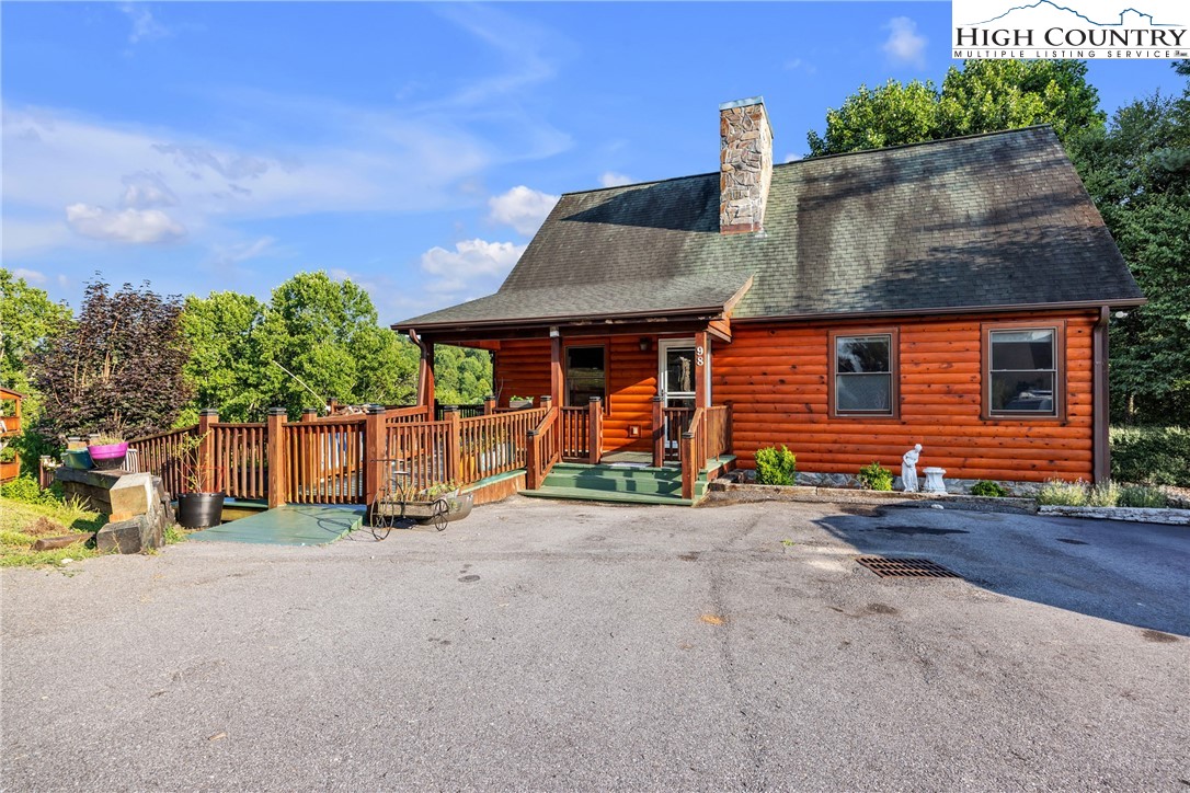 98 New Ridge Lane Piney Creek, NC 28663 - Photo 44 of 50 a front view of a house with garden