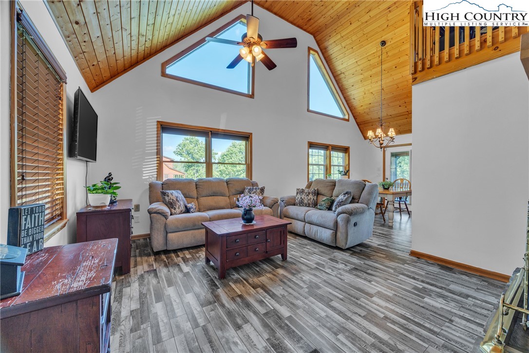 98 New Ridge Lane Piney Creek, NC 28663 - Photo 6 of 50 a living room with furniture and a wooden floor