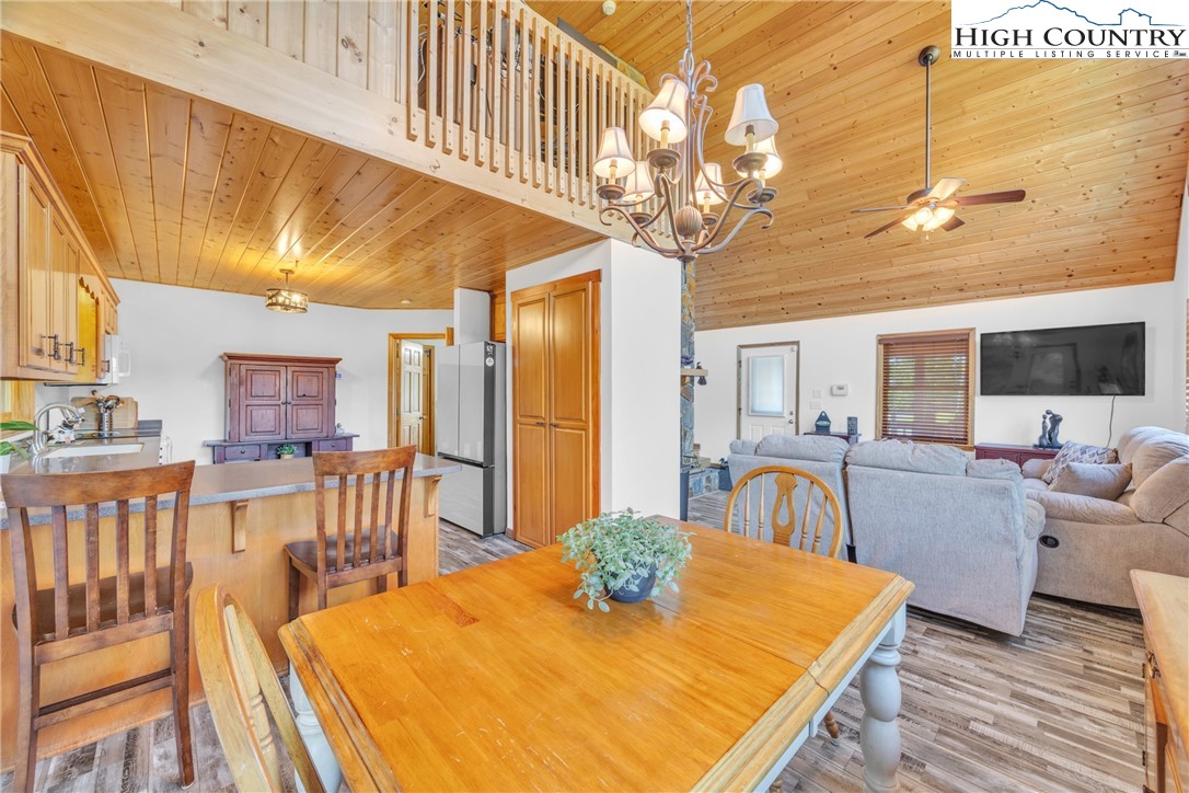 98 New Ridge Lane Piney Creek, NC 28663 - Photo 10 of 50 a view of a dining room with furniture and a chandelier