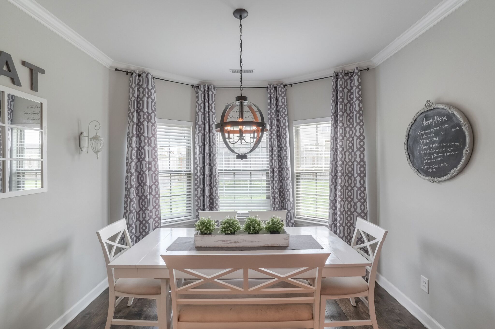 1057 Golf View Way Spring Hill, TN 37174 - Photo 12 of 29 a view of a dining room with furniture window and wooden floor