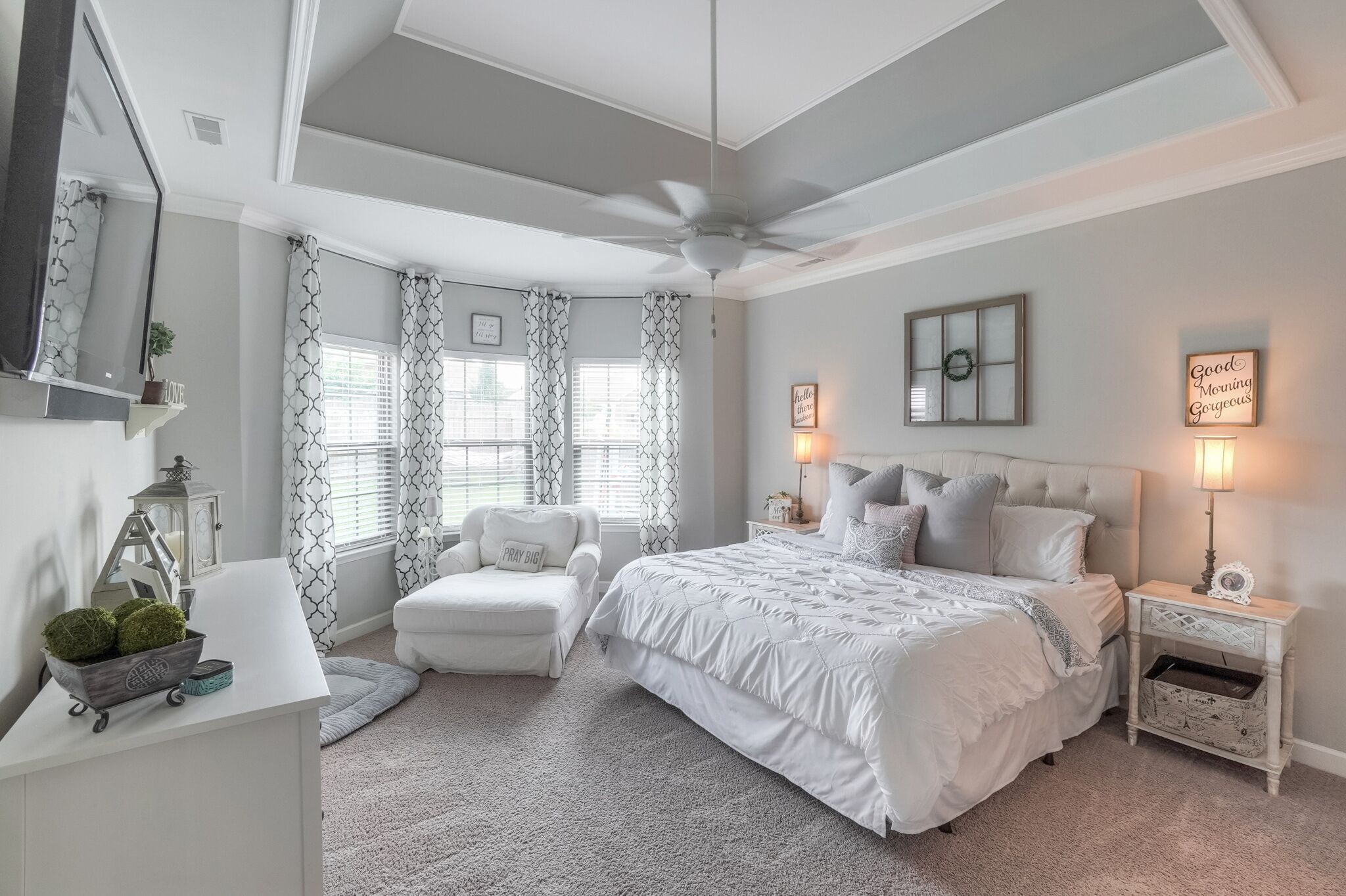 1057 Golf View Way Spring Hill, TN 37174 - Photo 13 of 29 a bedroom with a bed a couch and a flat tv screen