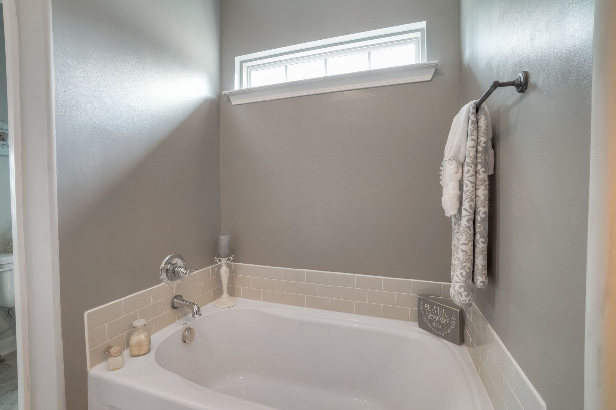 1057 Golf View Way Spring Hill, TN 37174 - Photo 17 of 29 a bathroom with a white bath tub and a shower