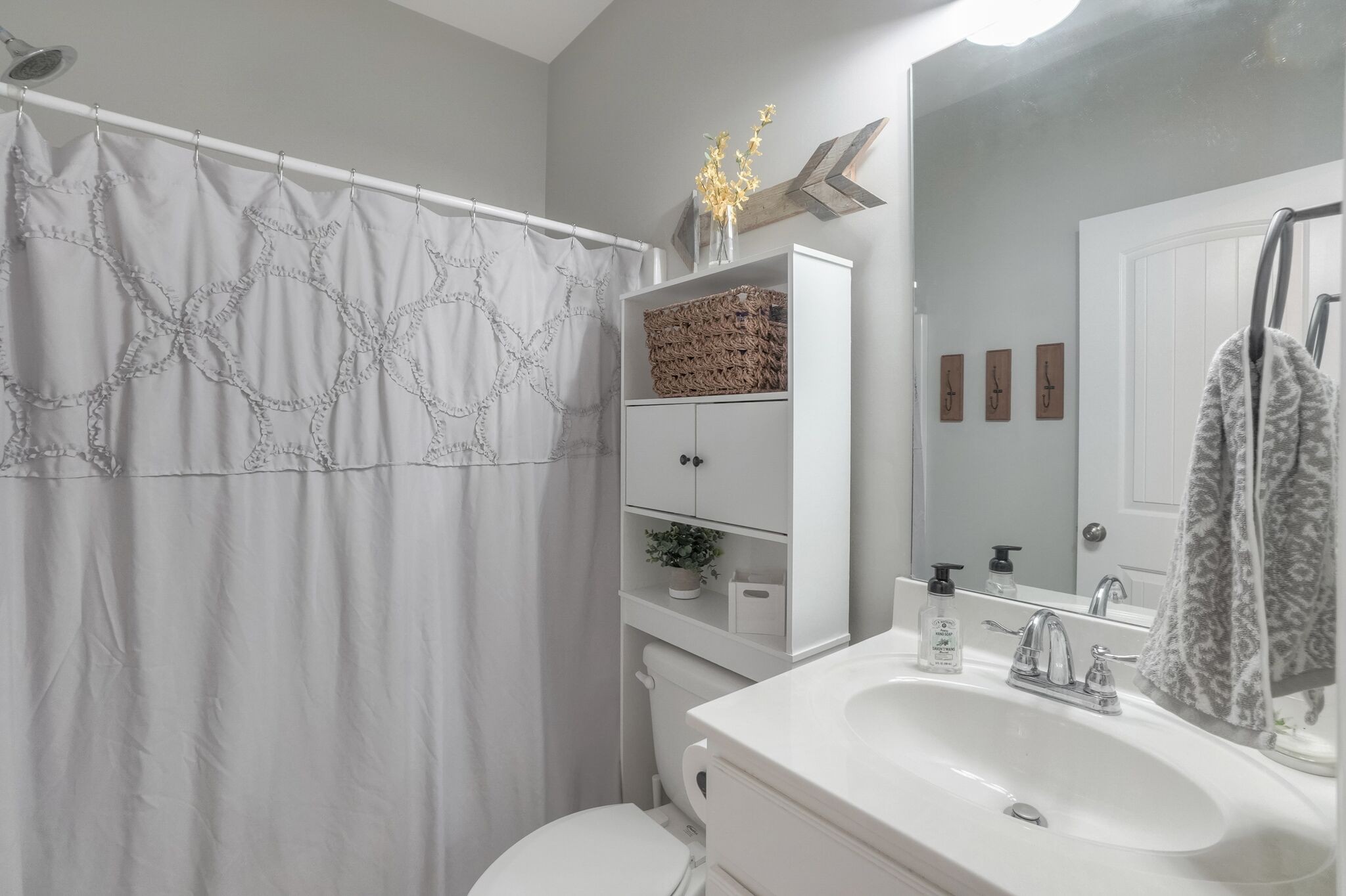 1057 Golf View Way Spring Hill, TN 37174 - Photo 22 of 29 a bathroom with a sink vanity mirror and toilet