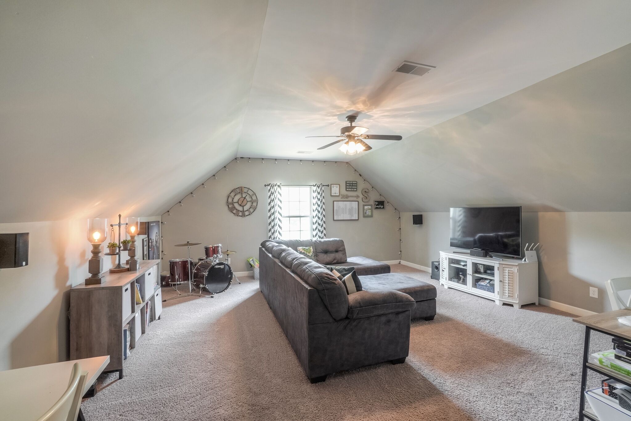1057 Golf View Way Spring Hill, TN 37174 - Photo 24 of 29 a living room with furniture and a flat screen tv
