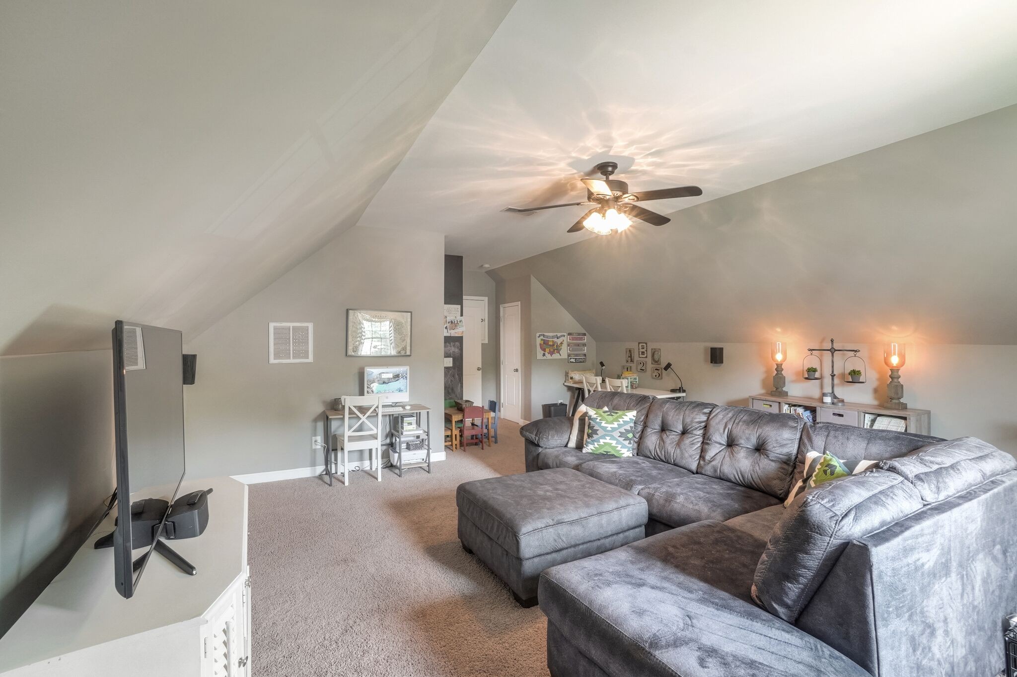 1057 Golf View Way Spring Hill, TN 37174 - Photo 25 of 29 a living room with furniture and a flat screen tv