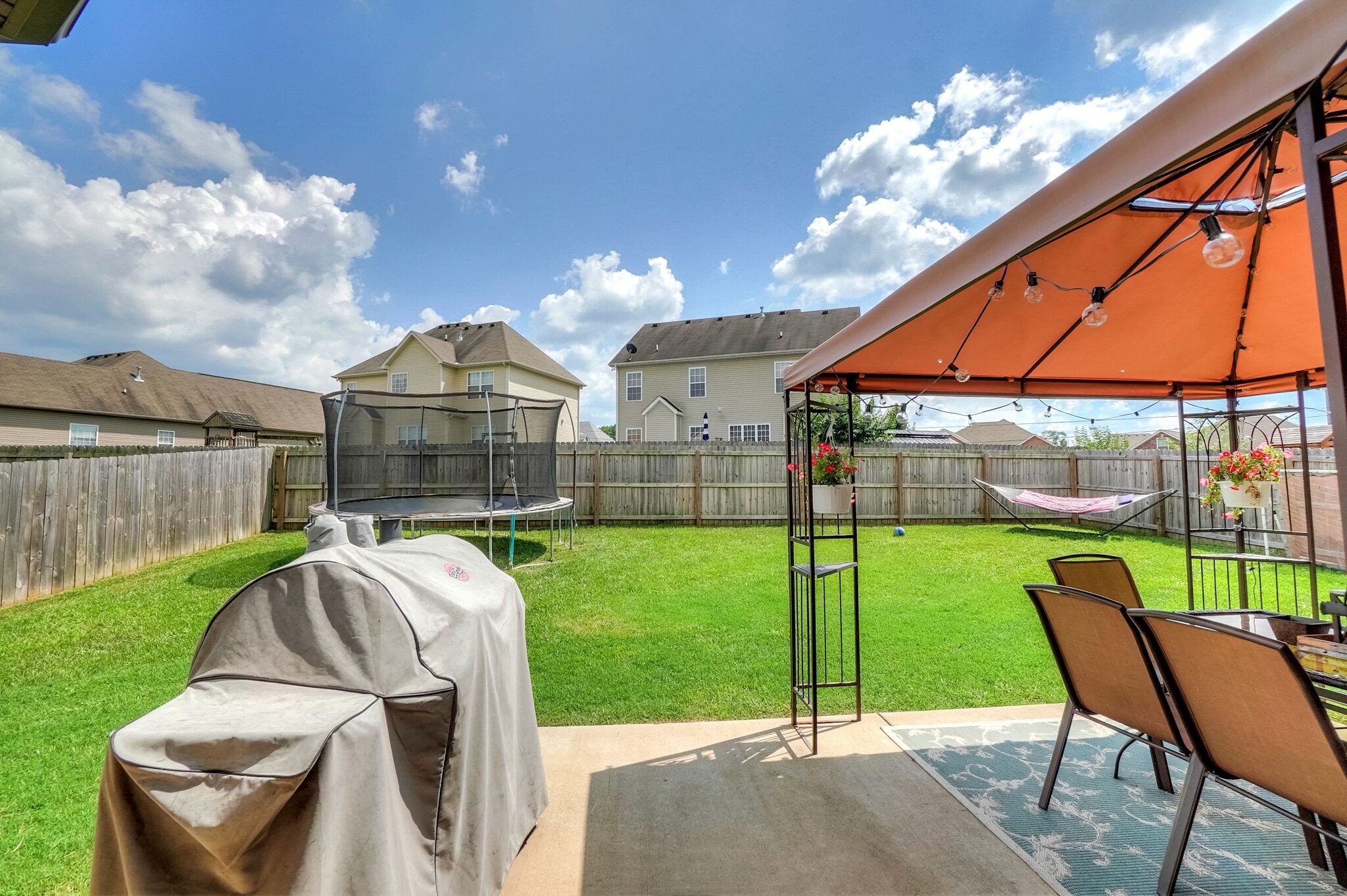 1057 Golf View Way Spring Hill, TN 37174 - Photo 27 of 29 a view of a backyard with sitting area