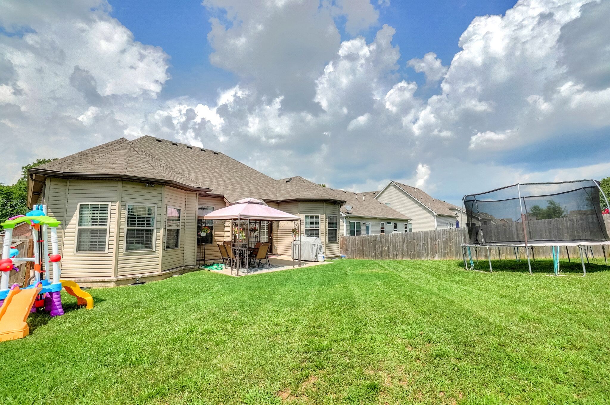1057 Golf View Way Spring Hill, TN 37174 - Photo 28 of 29 a view of a house with a yard and sitting area