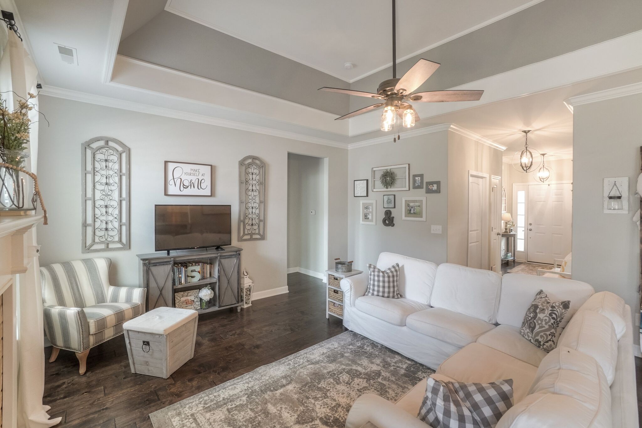 1057 Golf View Way Spring Hill, TN 37174 - Photo 8 of 29 a living room with furniture a flat screen tv and a large window
