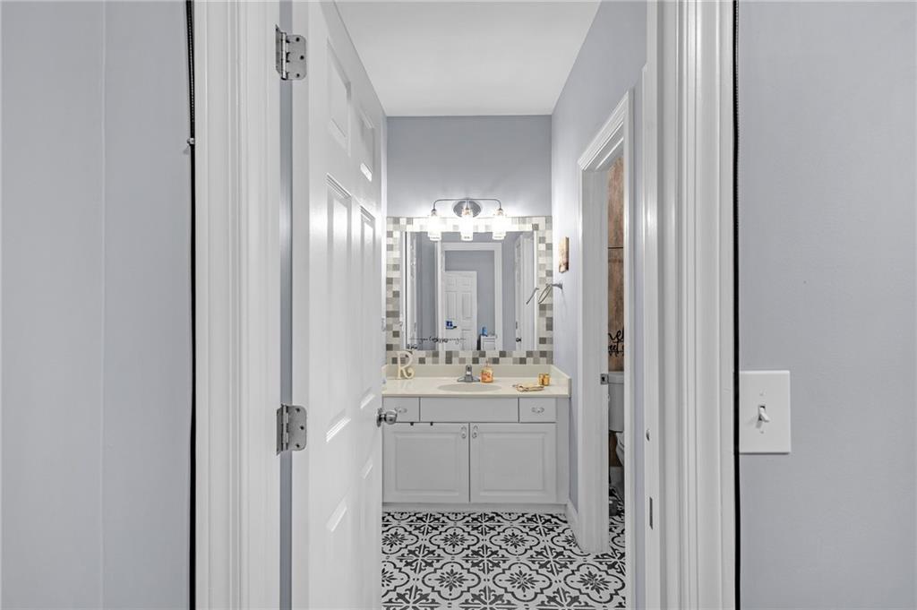 151 Dumar Lane Hoschton, GA 30548 - Photo 15 of 69 a bathroom with a sink a mirror and a shower