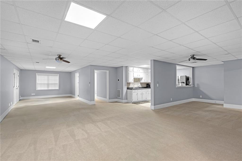 151 Dumar Lane Hoschton, GA 30548 - Photo 42 of 69 a view of empty room with windows and cabinet