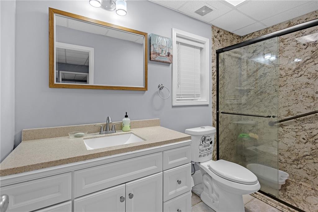 151 Dumar Lane Hoschton, GA 30548 - Photo 50 of 69 a bathroom with a sink toilet and mirror