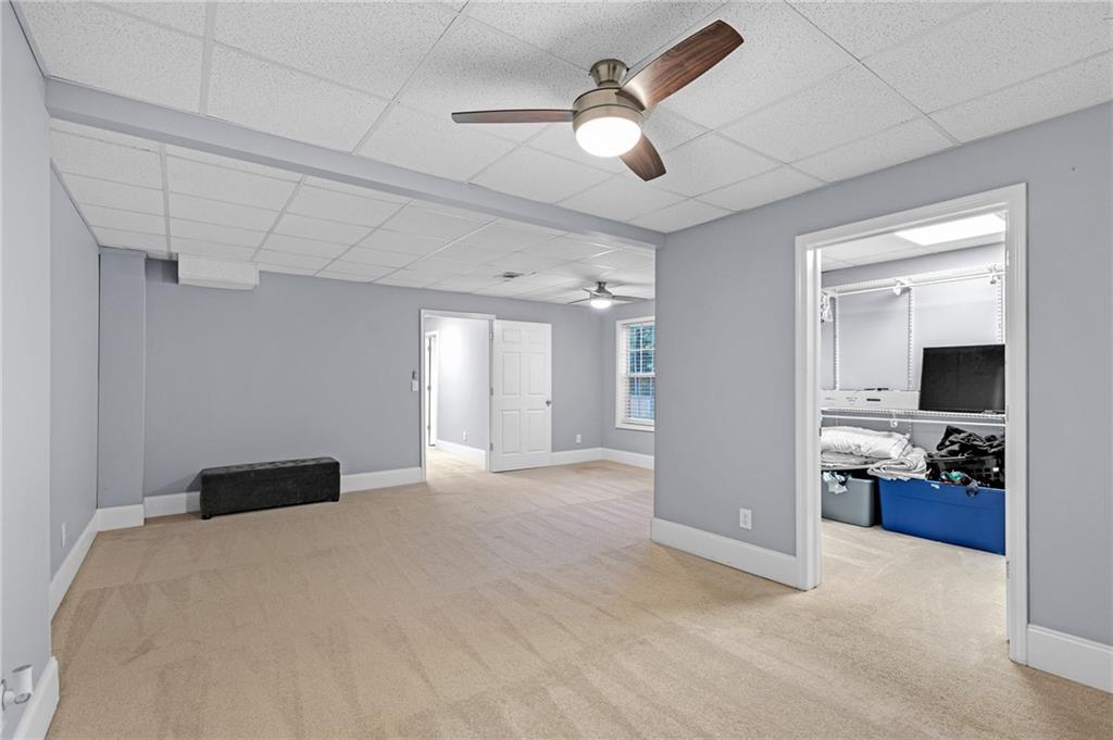 151 Dumar Lane Hoschton, GA 30548 - Photo 54 of 69 a view of a livingroom with a flat screen tv