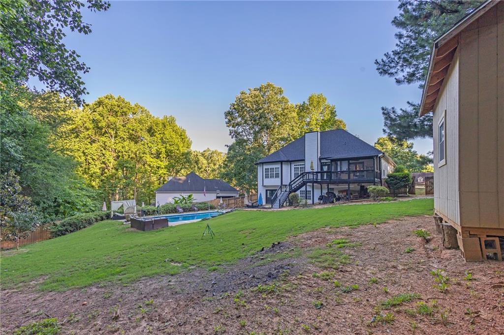 151 Dumar Lane Hoschton, GA 30548 - Photo 65 of 69 a view of a house with a backyard