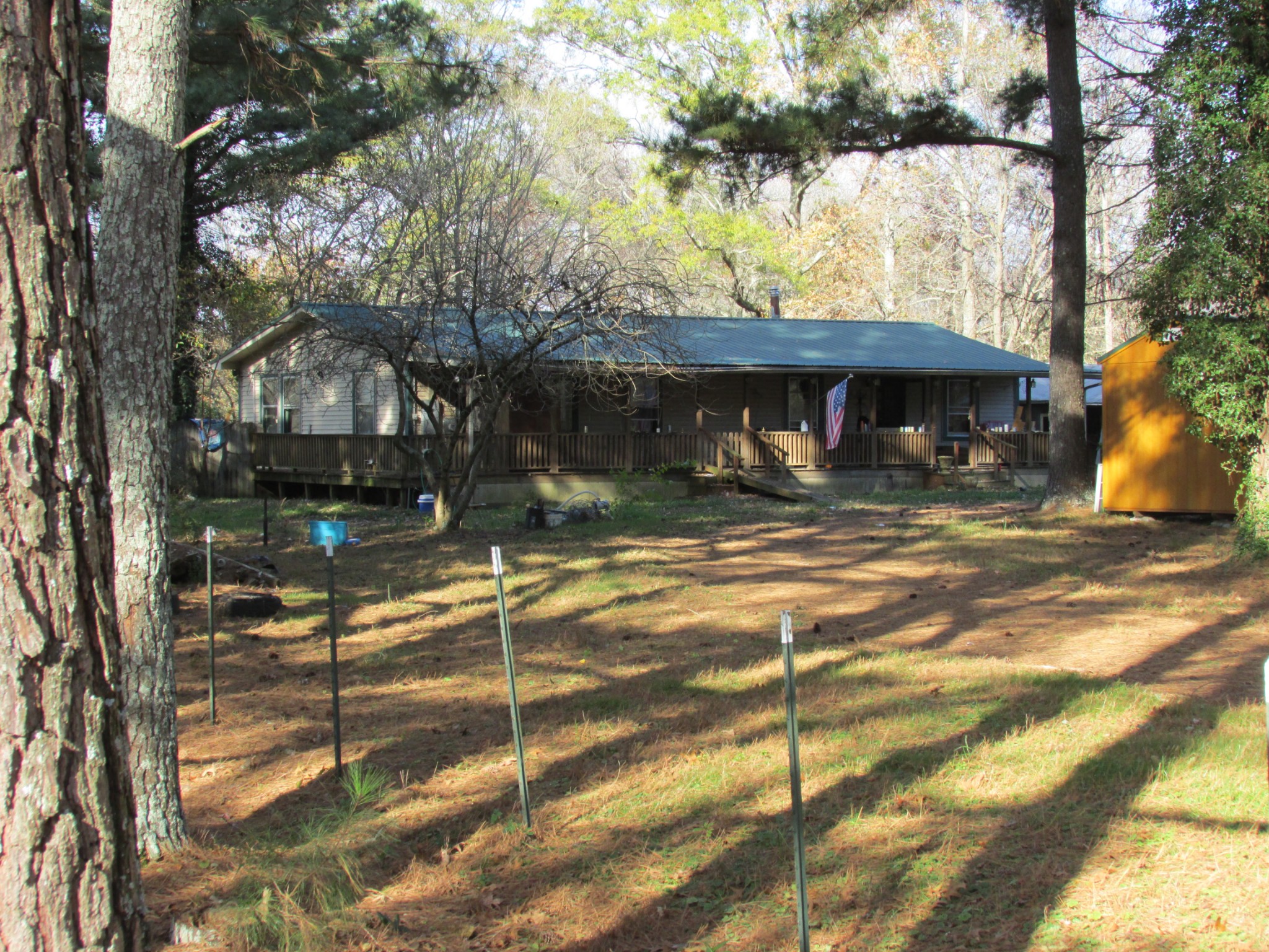 111 Howard Carr Road Manchester, TN 37355 - Photo 2 of 21 a backyard of a house with barbeque oven table and chairs