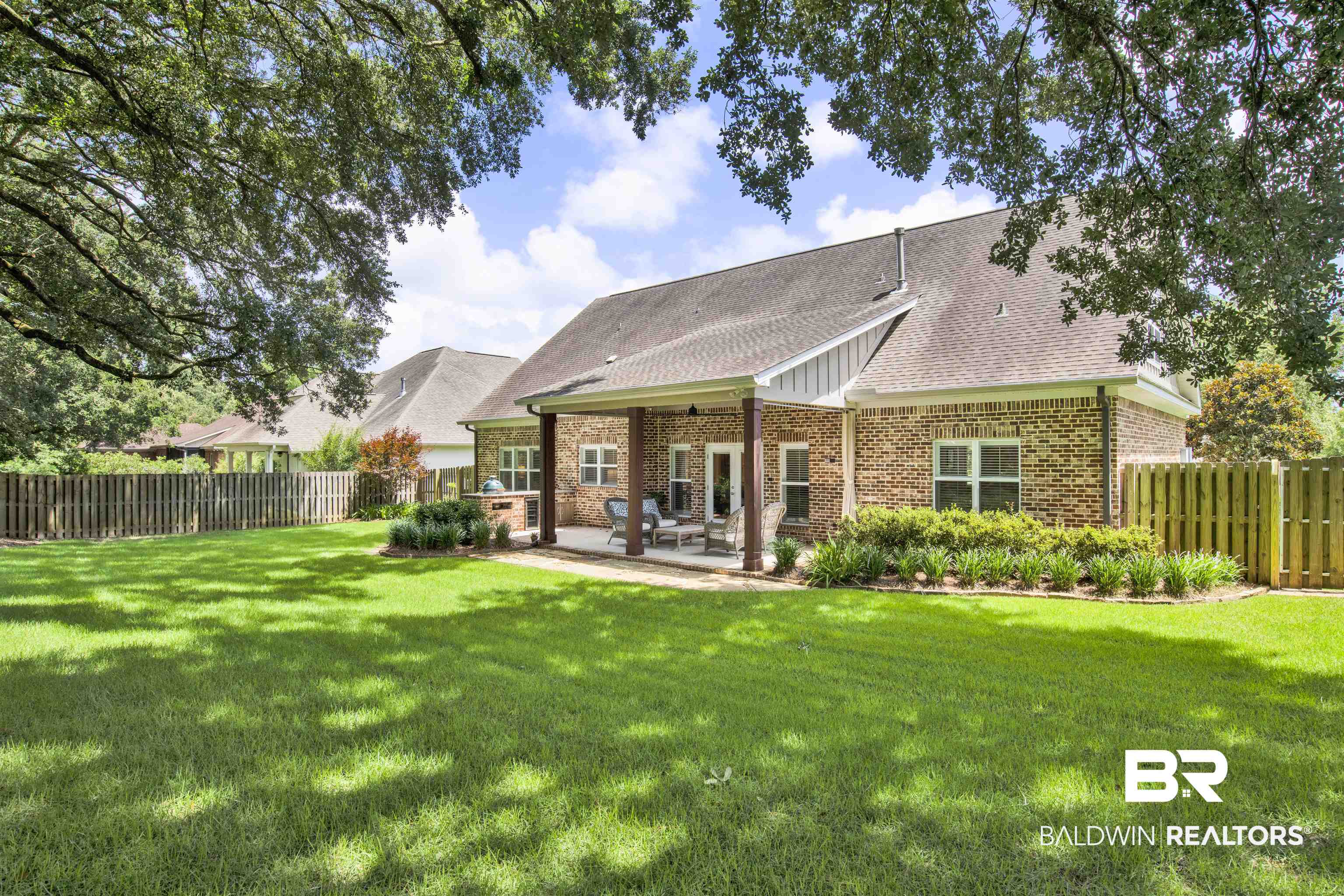 131 Sedgefield Avenue Fairhope, AL 36532 - Photo 40 of 50 Rear view of house featuring a yard