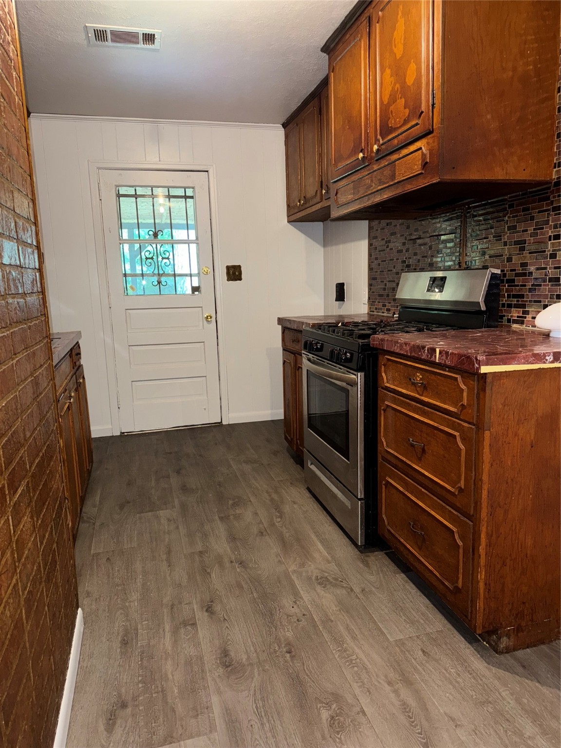 5335 Landry Lane Beaumont, TX 77708 - Photo 3 of 22 SPACIOUS KITCHEN WITH BACKDOOR LEADING TO BACK PATIO & SPACIOUS BACKYARD.